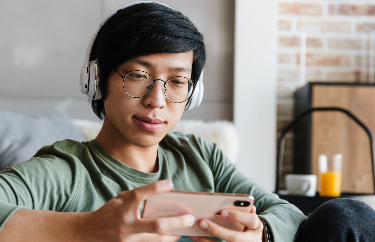 smartphone user with wireless headphones on