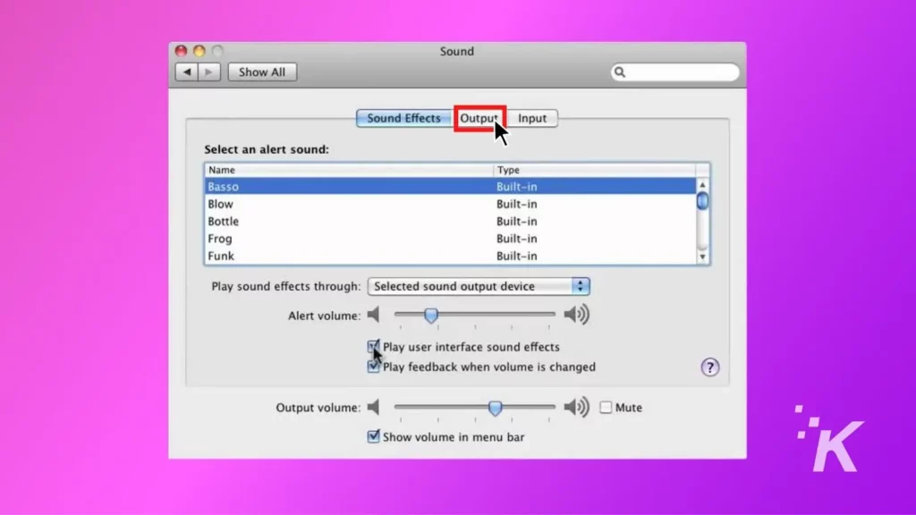 tangkapan layar menu pengaturan output audio macos pada latar belakang ungu