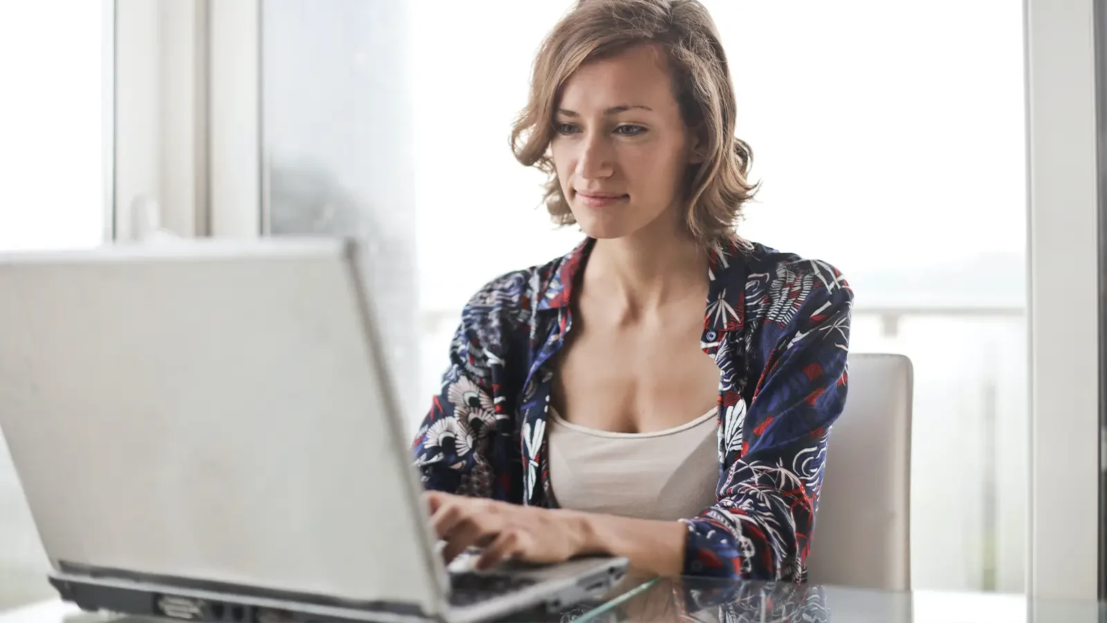 Woman typing on laptop