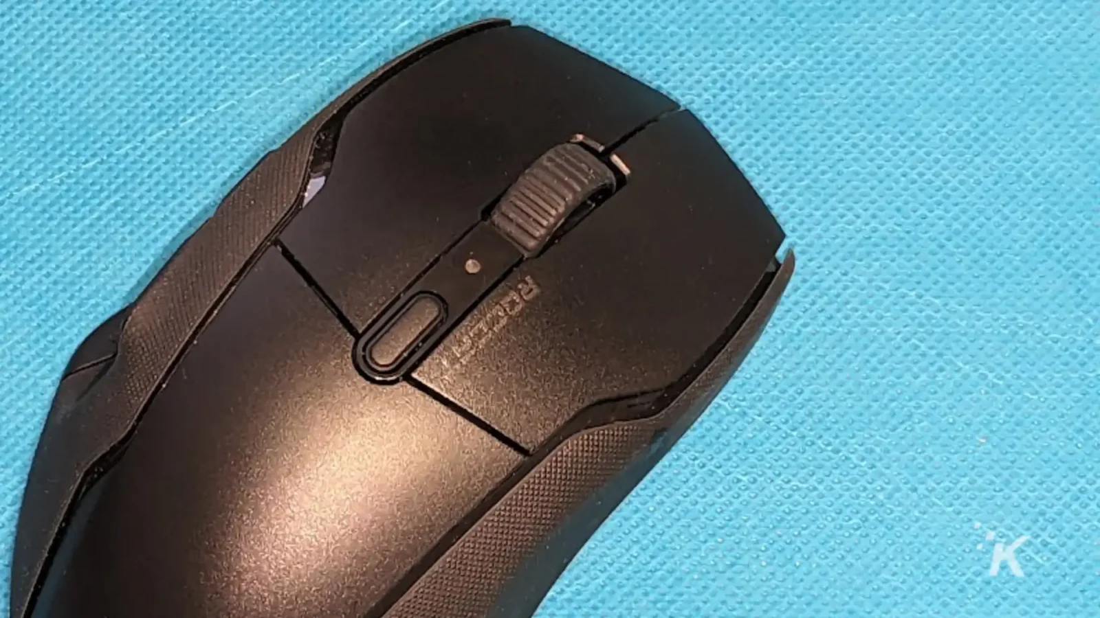 Roccat kone air wireless mouse on a blue cloth