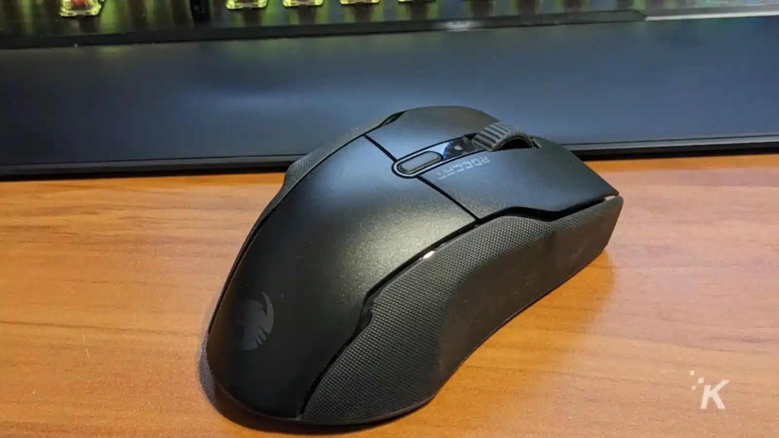 Roccat kone air wireless mouse in front of a gaming keyboard