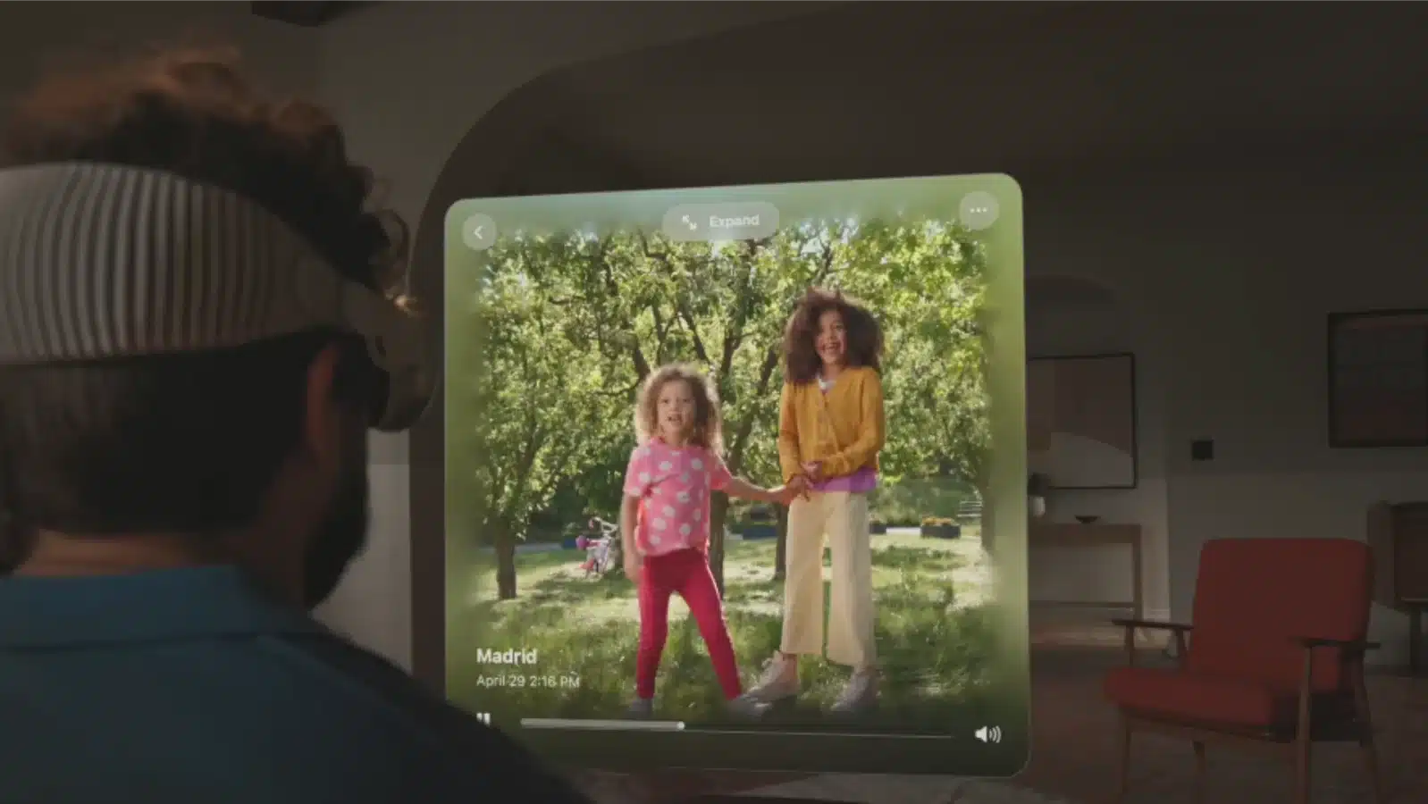 A man is using the apple vision pro headset to view a video in augmented reality