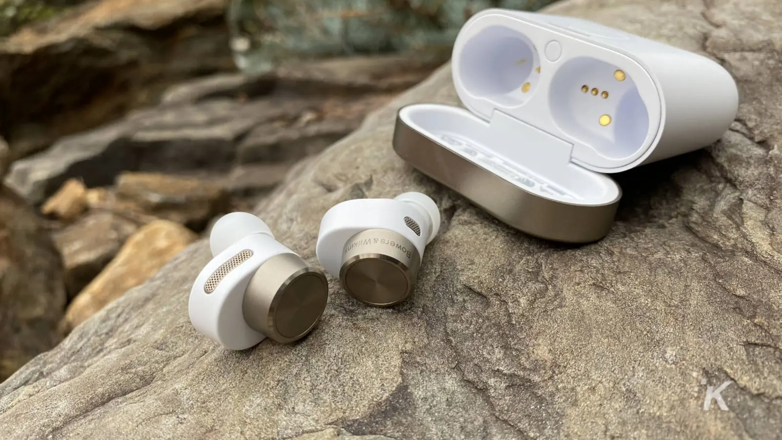 Bowers and wilkins pi7 earbuds on a rock