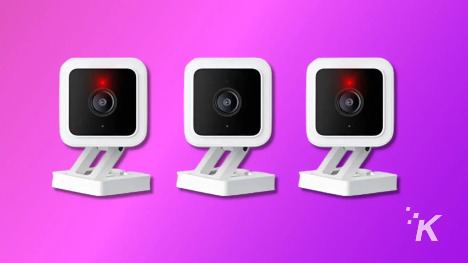 Three similar white webcams with red recording lights, mounted on adjustable stands, presented against a gradient purple background with a watermark.