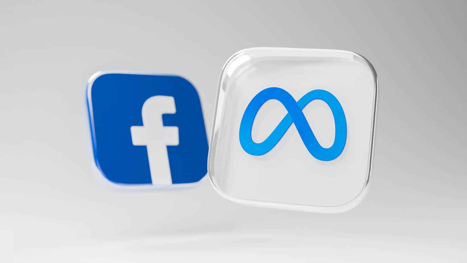 Meta- und Facebook-Logo auf grauem Hintergrund