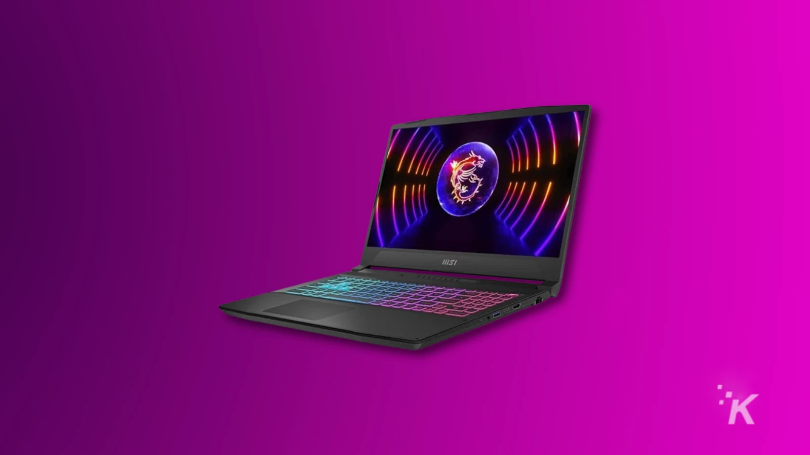 Laptop gaming dengan keyboard warna-warni dan tampilan layar cerah.