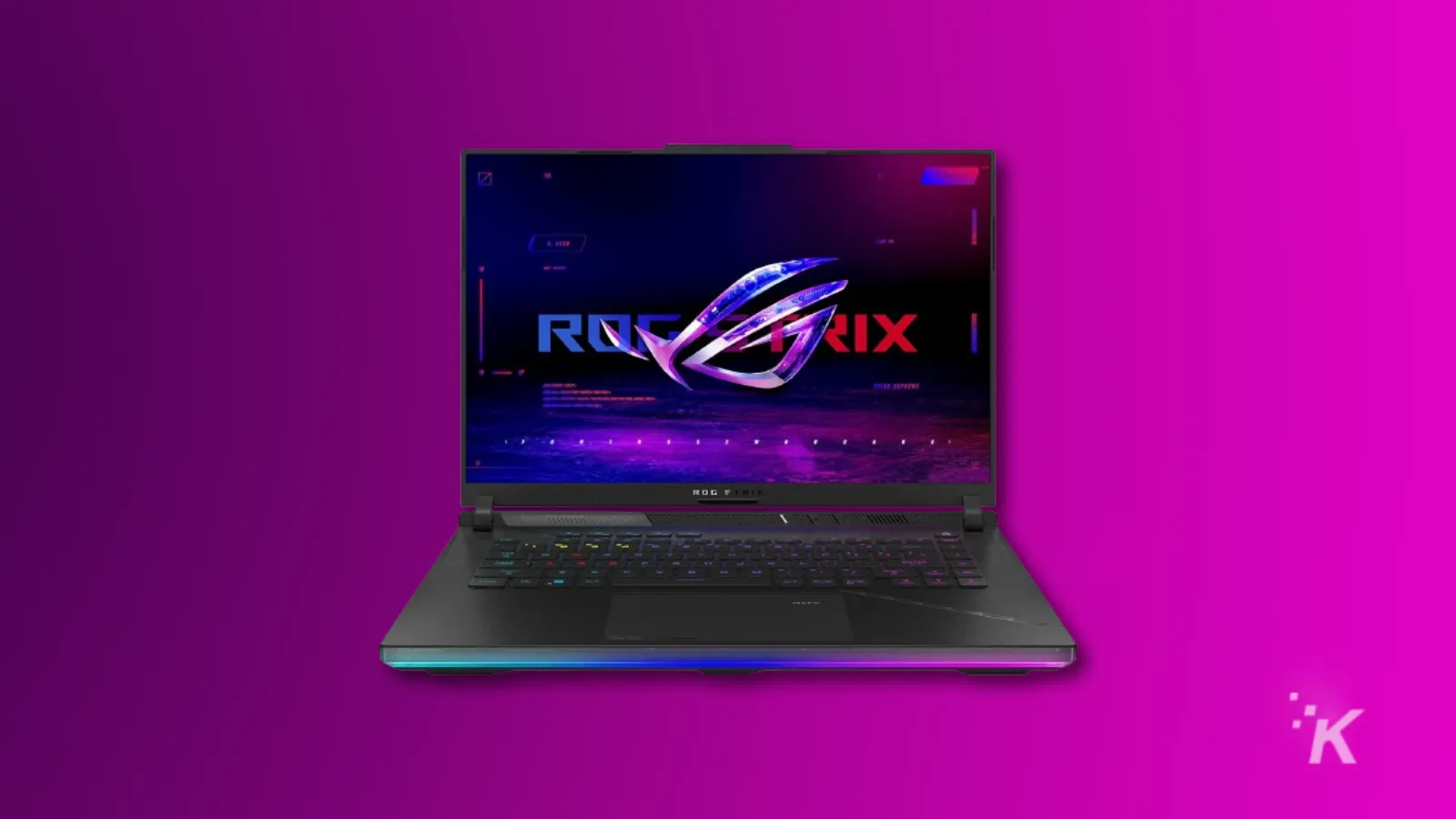 Laptop ROG Strix dengan logo bersinar di layar.