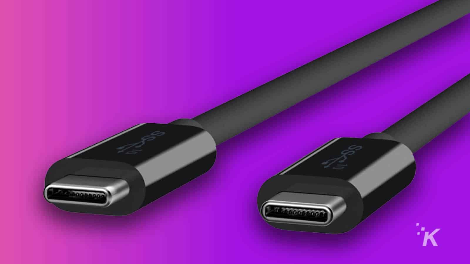 kabel usb-c dengan latar belakang ungu