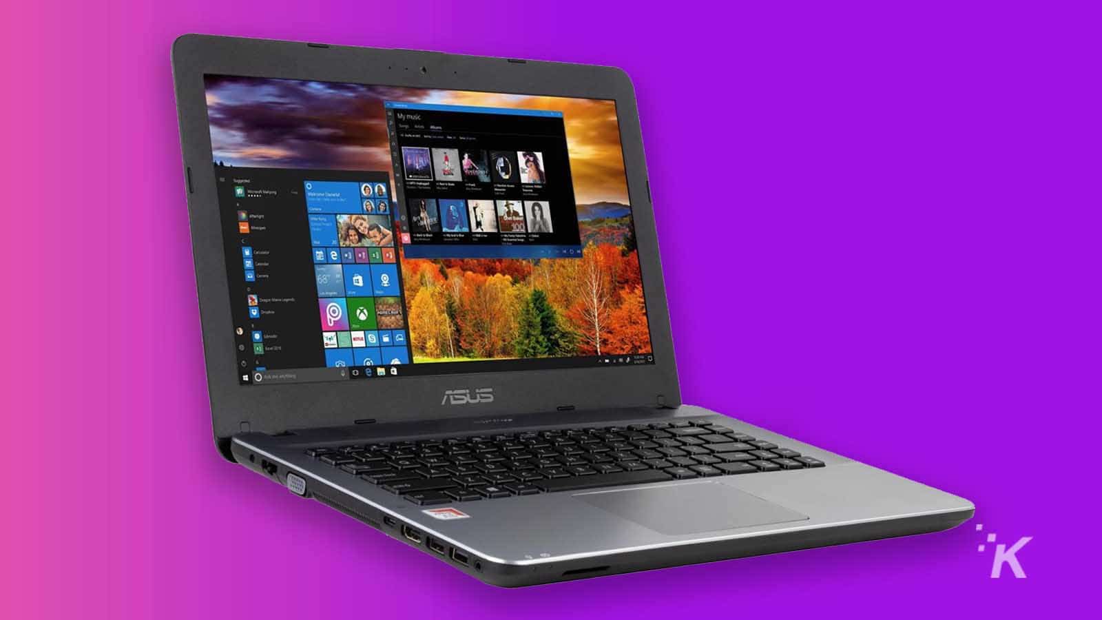 laptop asus dengan latar belakang ungu